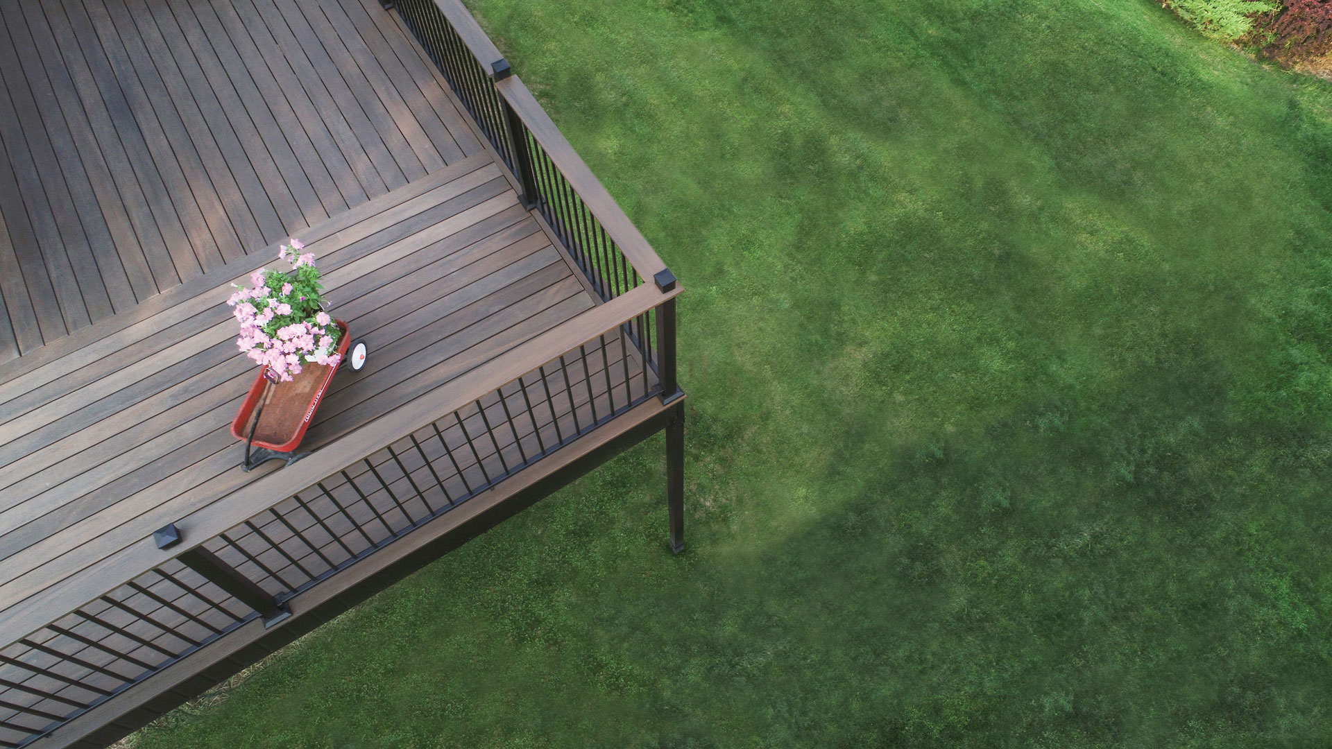 Overhead view of dark aluminum railing surrounding a deck.