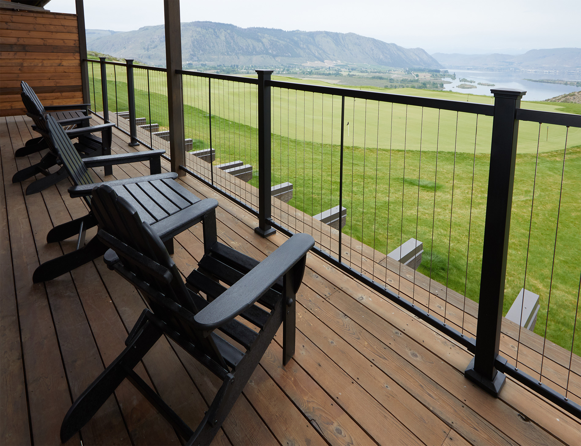 Balcony with railing perched over lawn