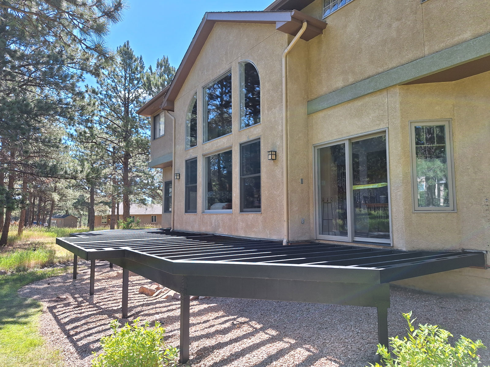 A steel deck frame installed on a home creates a strong, fire-resistant outdoor foundation, ensuring longevity and compliance with WUI building codes.