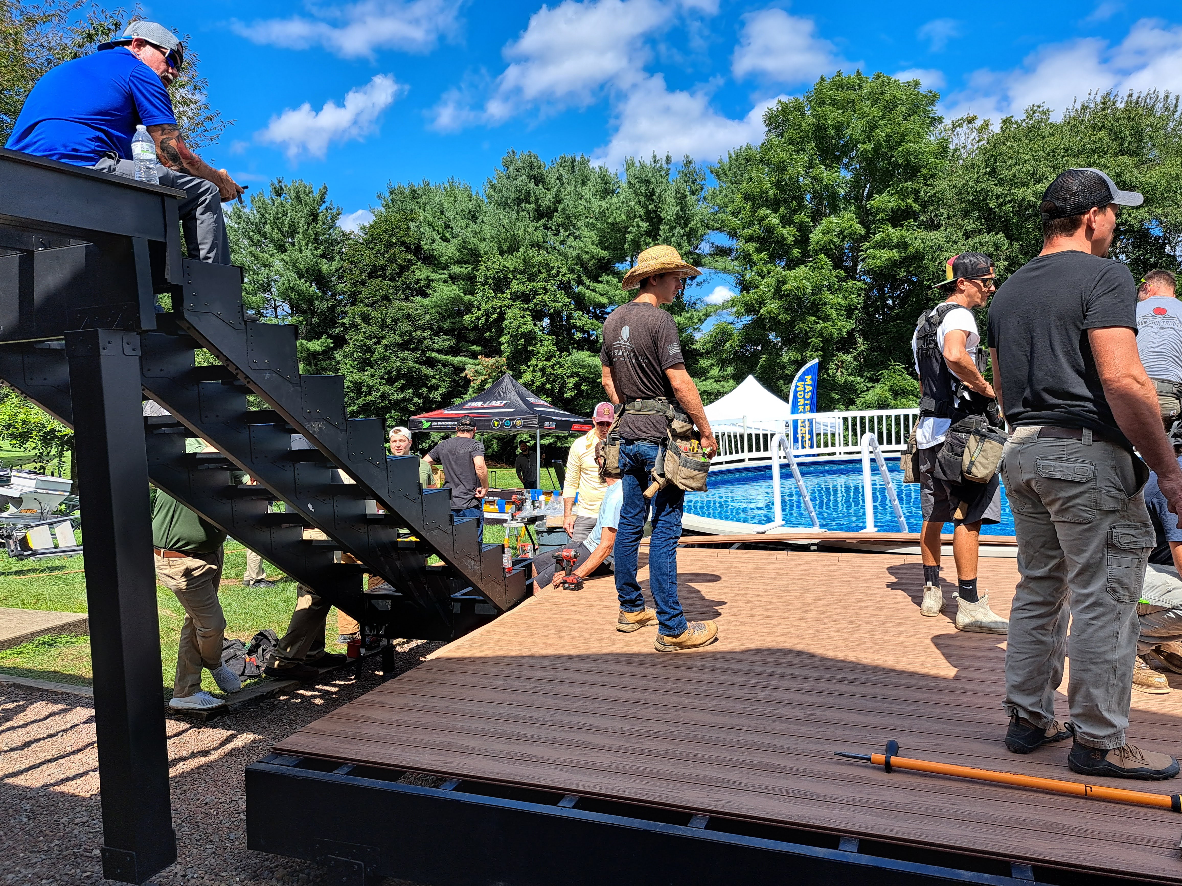 Ravin Builders working on the stairs of a steel-framed deck.