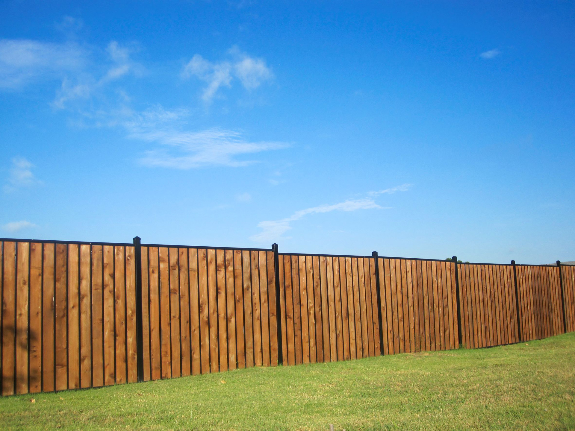 Steel and wood privacy fence.