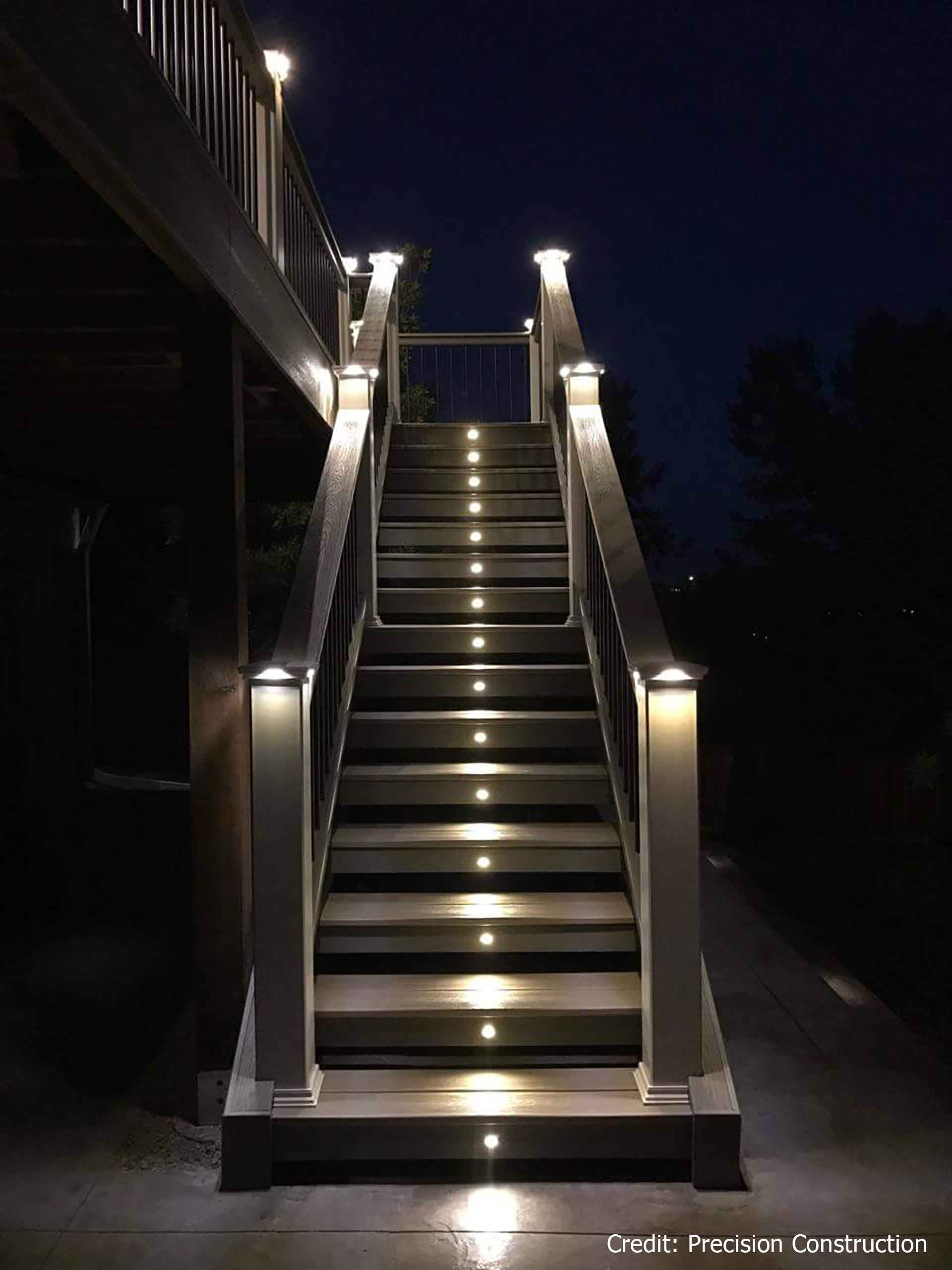 Lights on outdoor staircase featuring steel deck framing and design for nighttime visibility.