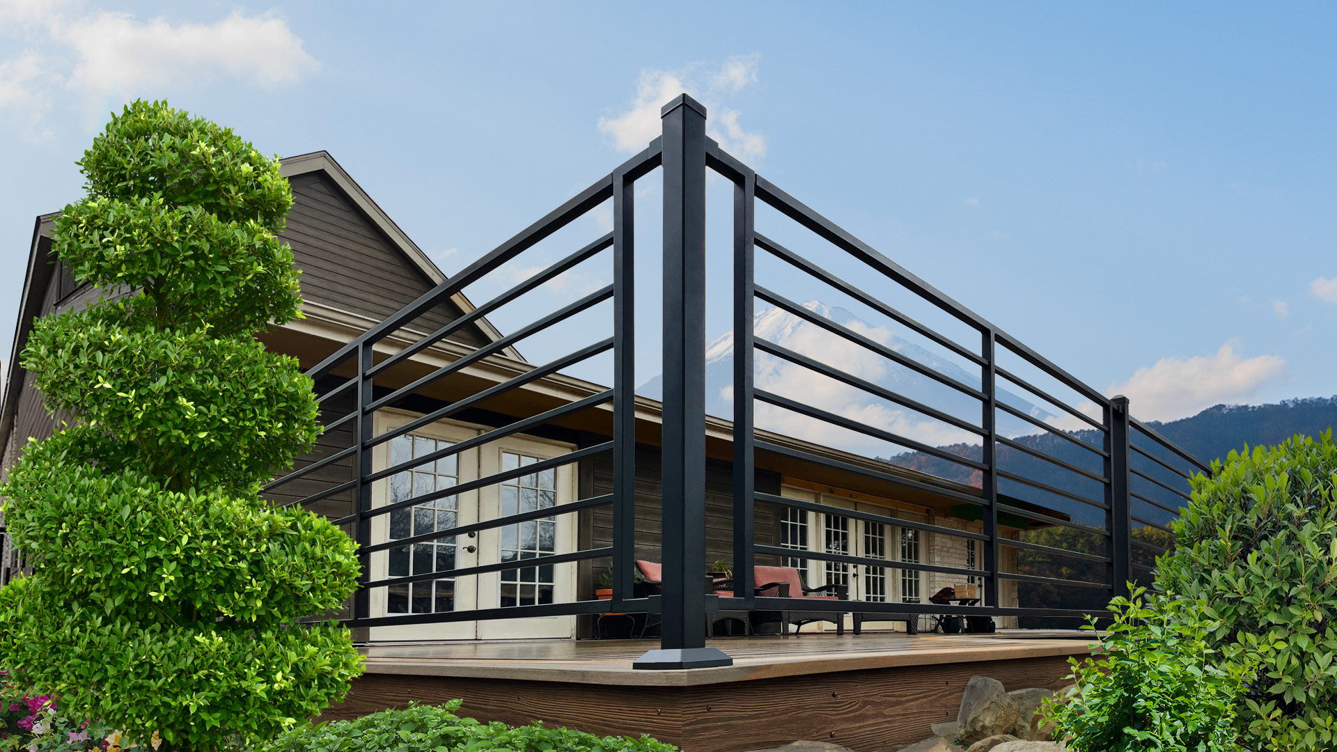 Upper deck patio with black deck railing enclosing the space.