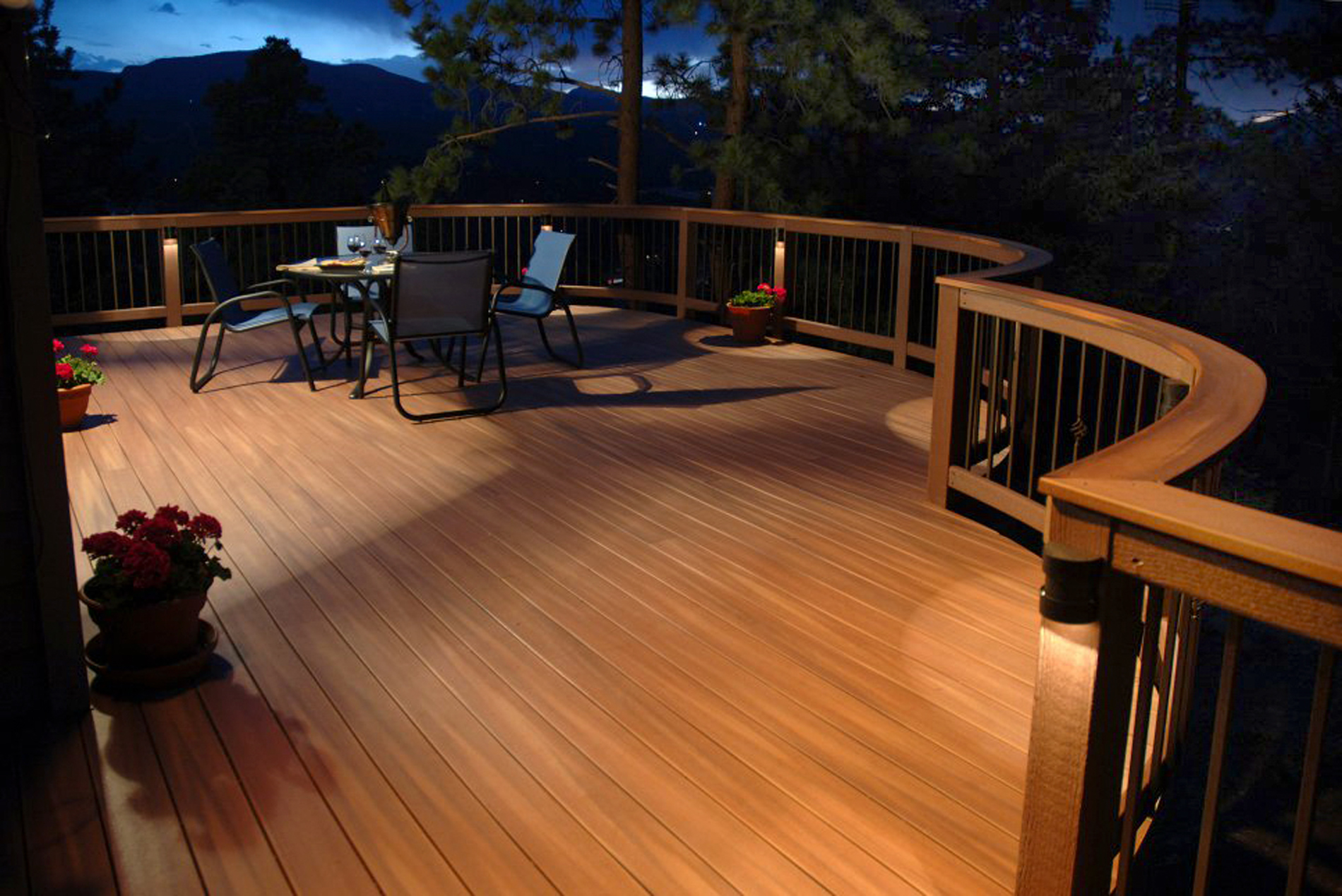 Composite deck illuminated by railing post lights