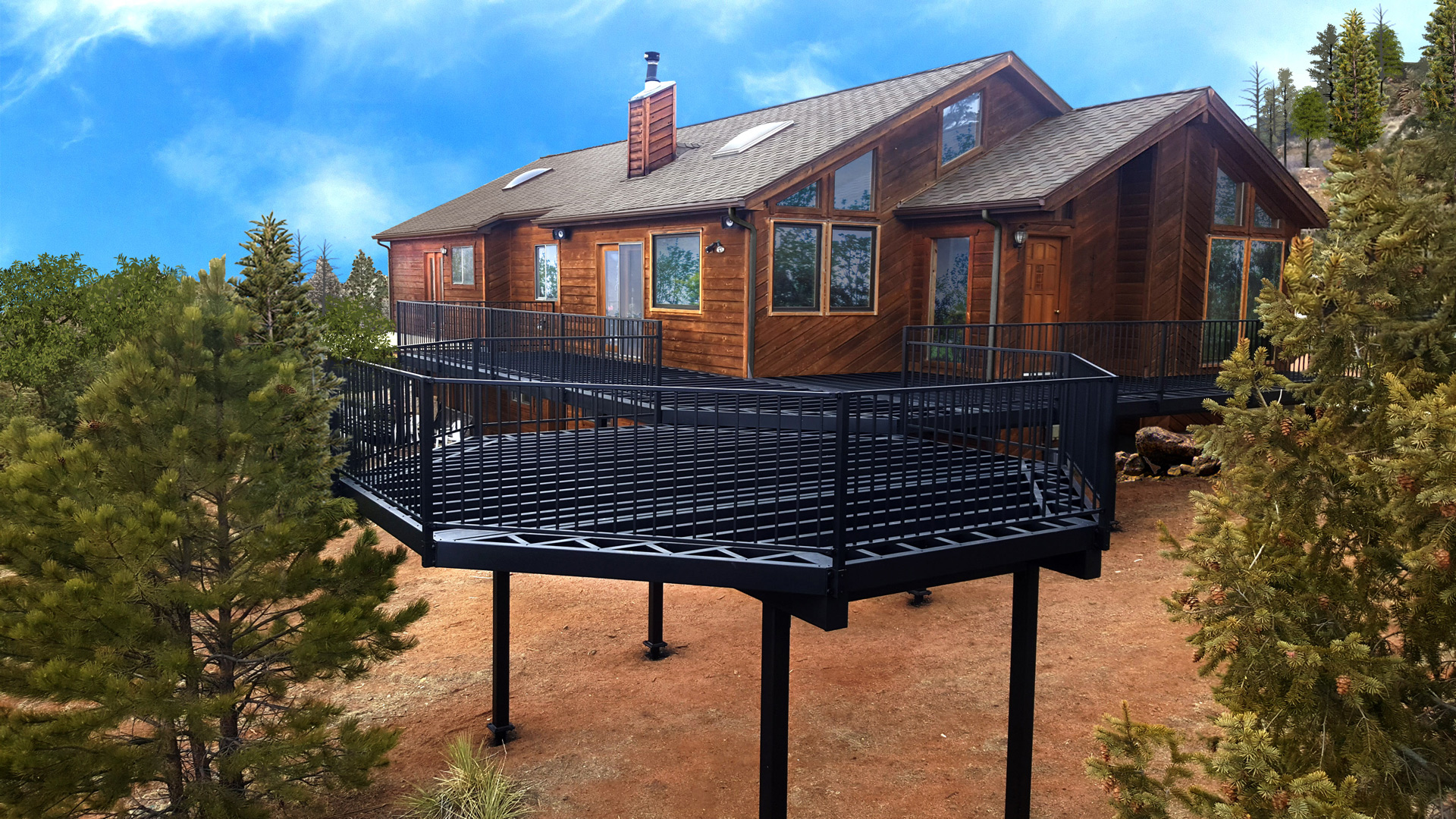 Scenic cabin in the woods with deck framing and railing ready to be finished with deck boards. 