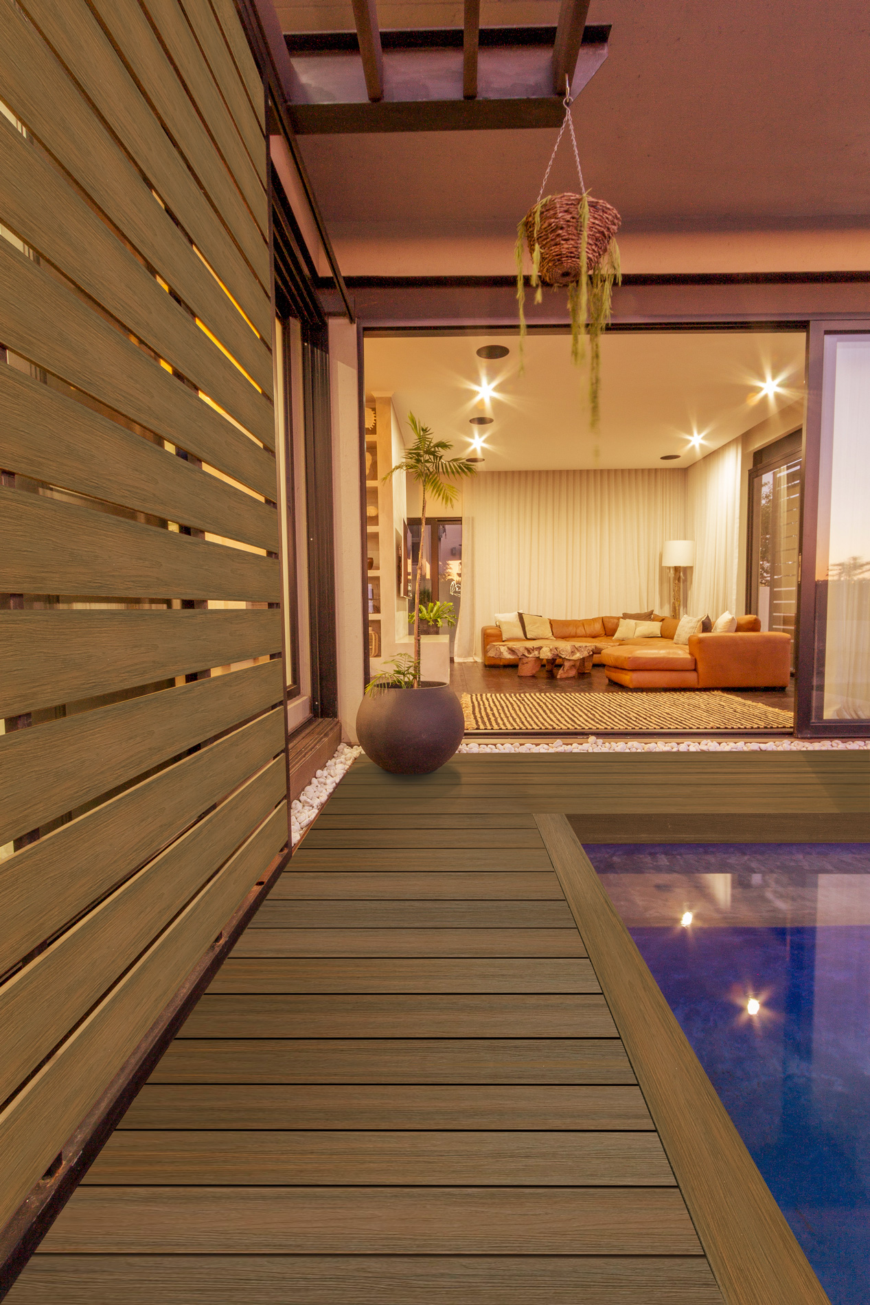 Composite boards are used as poolside decking and privacy cladding.