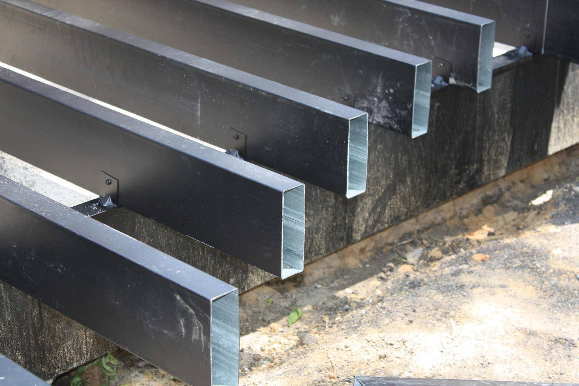 Steel deck joists in a row, ready for deck board installation.