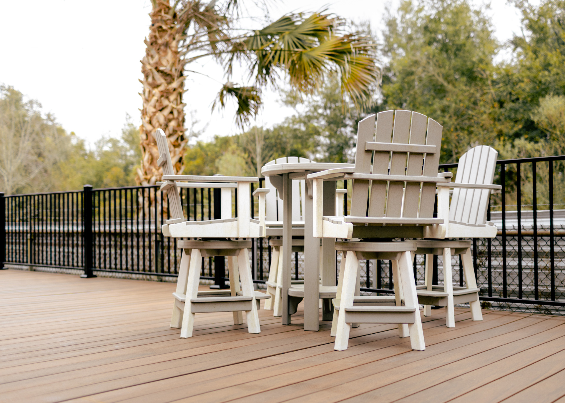 White patio furniture on composite deck