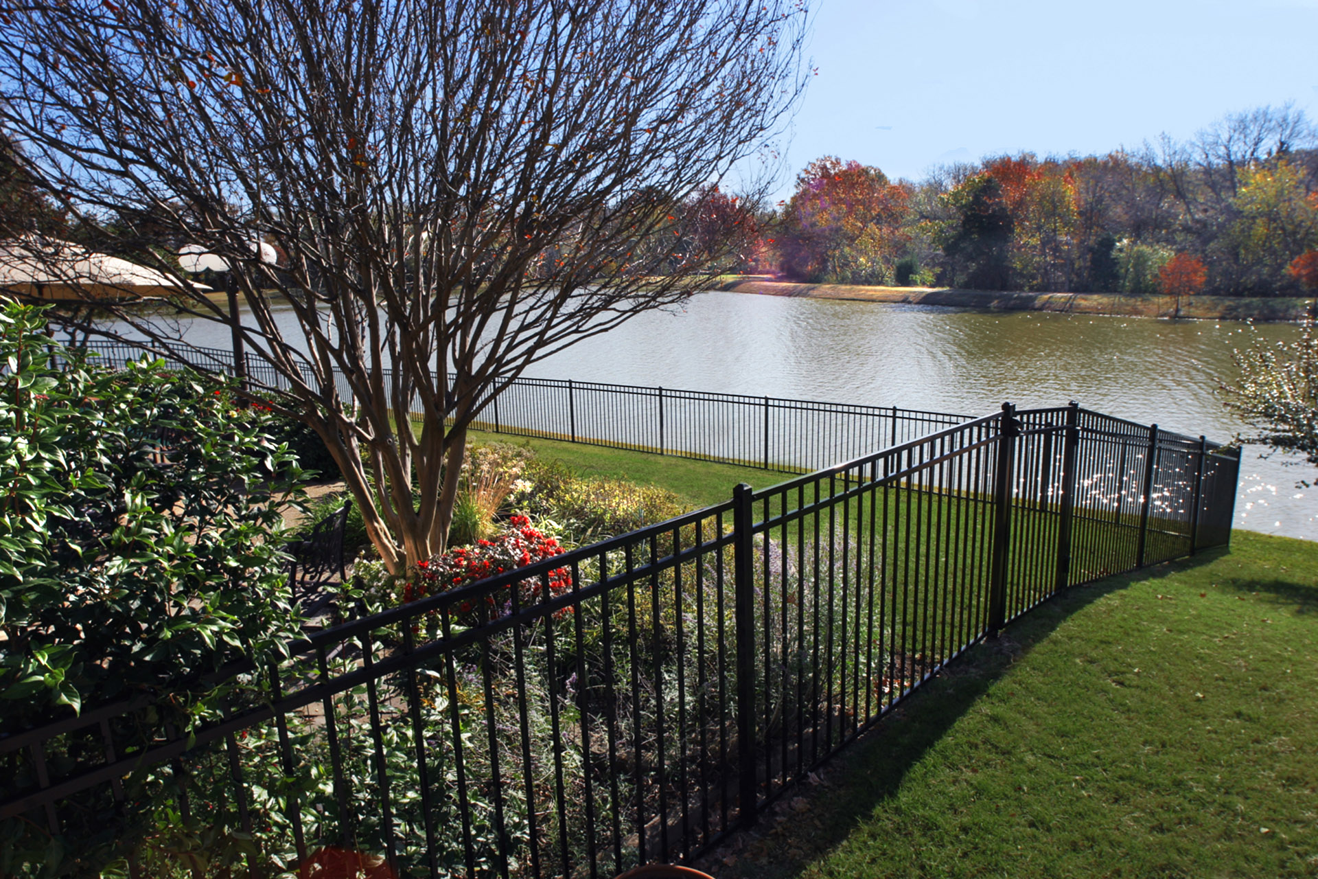 Noncombustible steel fence installed along a backyard.