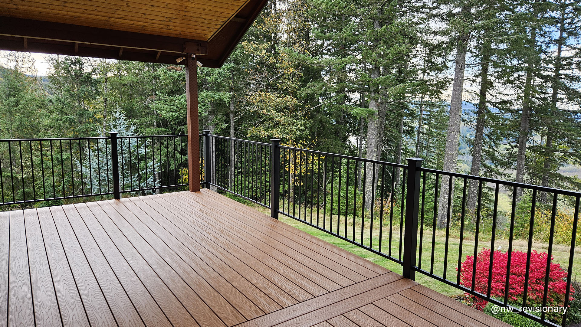 Multi-level deck featuring a sturdy railing, providing an elevated outdoor space for relaxation and enjoyment.