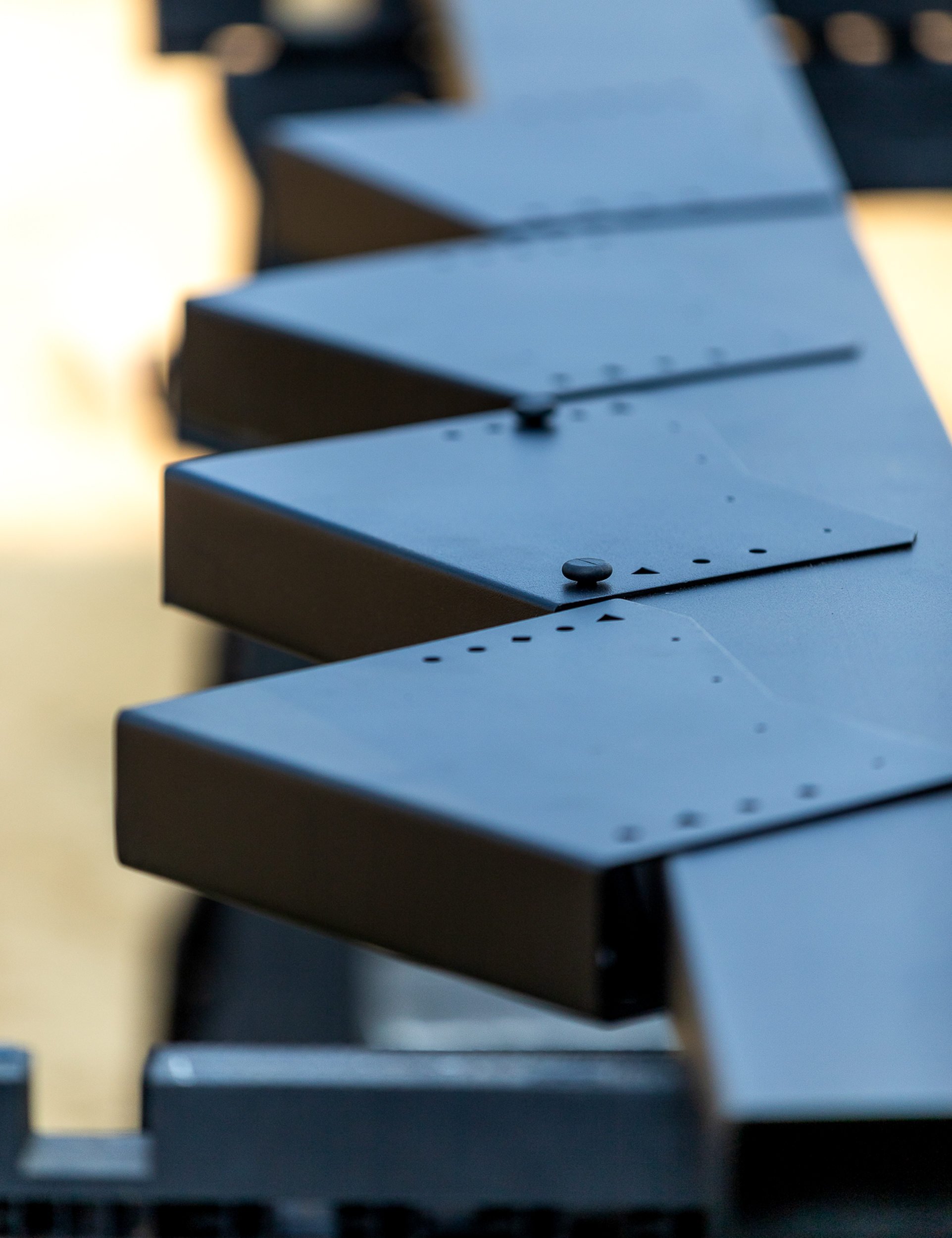 A close-up view of steel stair brackets, providing a strong, fire-rated, and weather-resistant balcony framing solution.