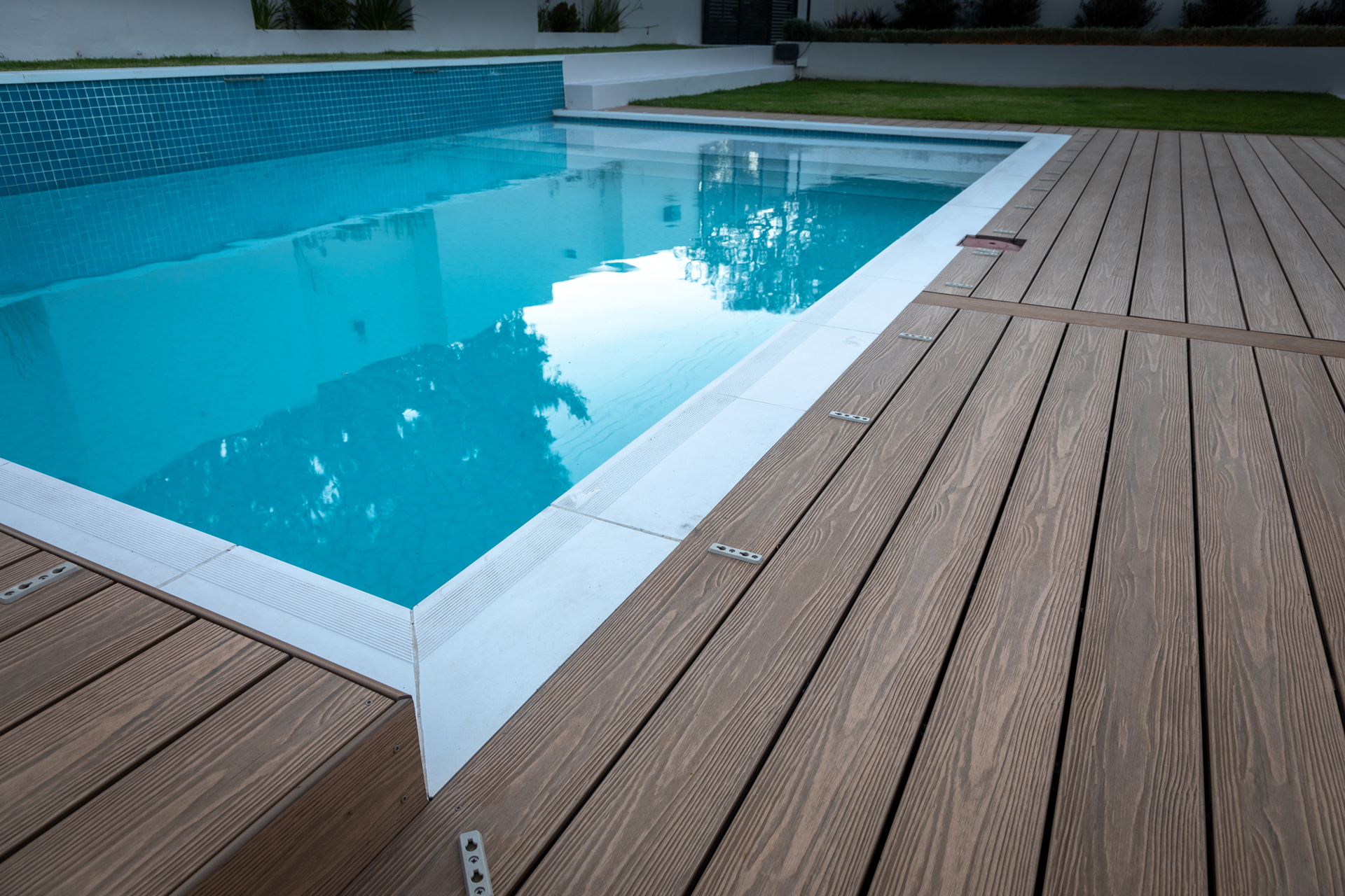 composite decking boards installed poolside 