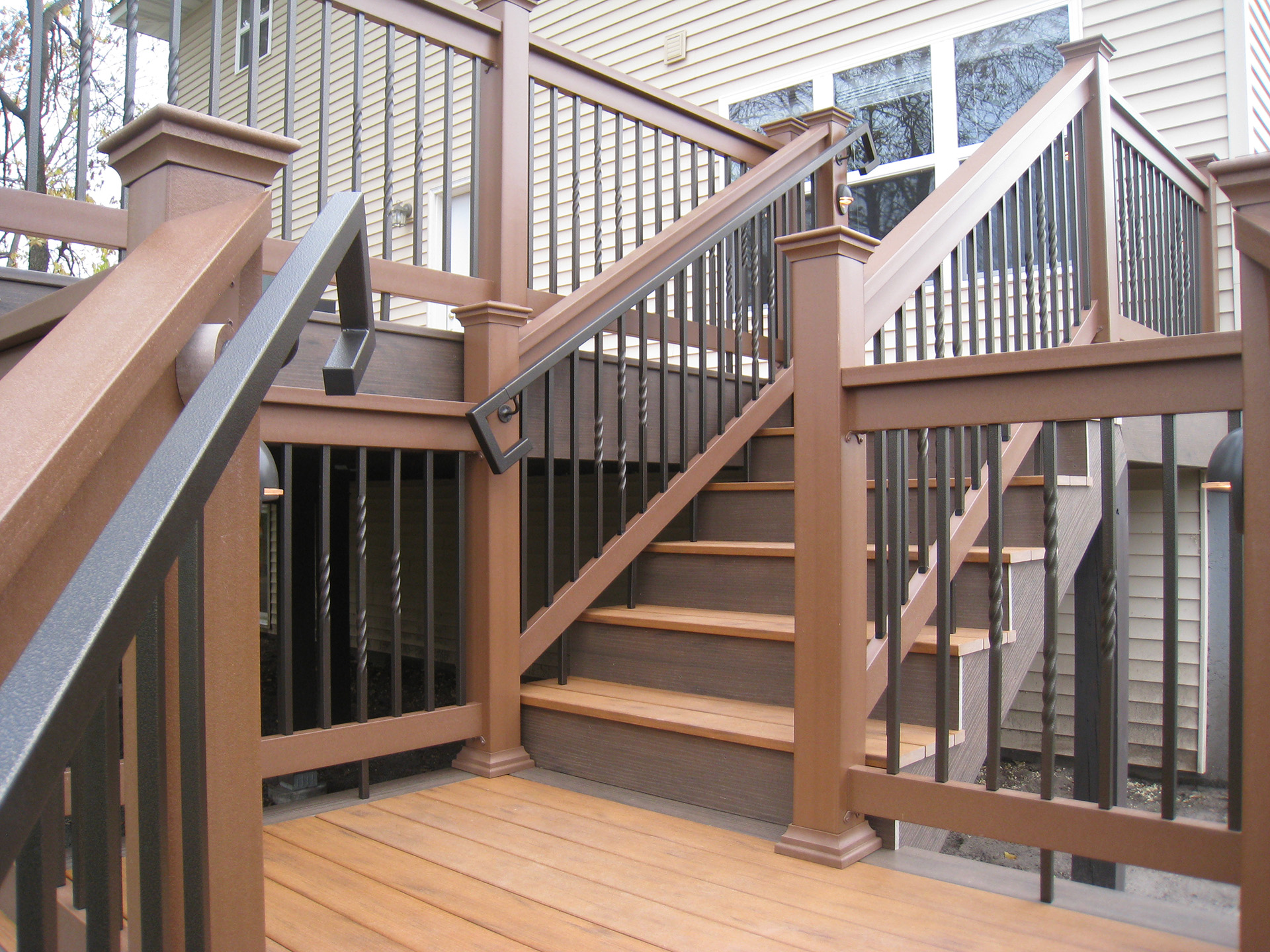 Deck stairs leading to upper level of a multilevel deck