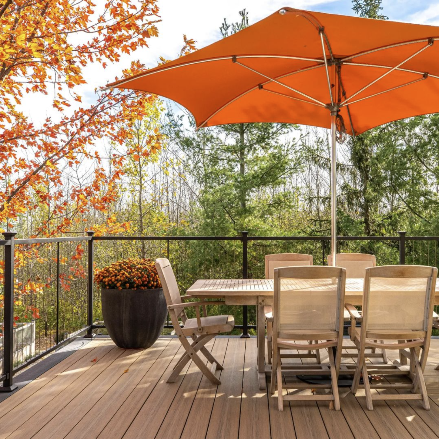 Steel deck framing with glass railing and pergola, showcasing outdoor living and deck post lights.