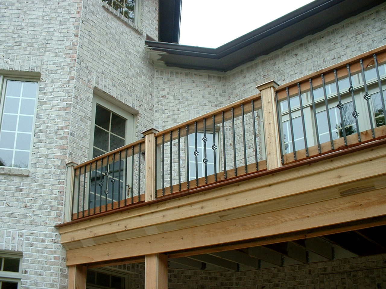 Balcony railing on brick house