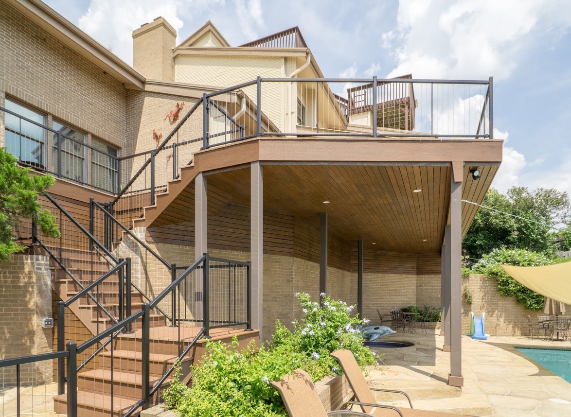 Multi-level deck with staircase leading to pool level
